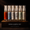 Set of six Roma sample perfume bottles on a wooden stand with a dark background.