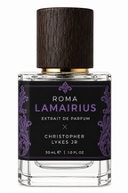 A 30ml bottle of Roma Lamairius Extrait de Parfum by Christopher Lykes Jr, featuring a clear glass bottle, a black label with purple damask patterns, and a dark wood-textured cap with a gold collar.